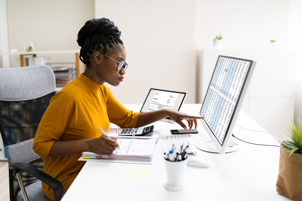 woman on computer tracking finances